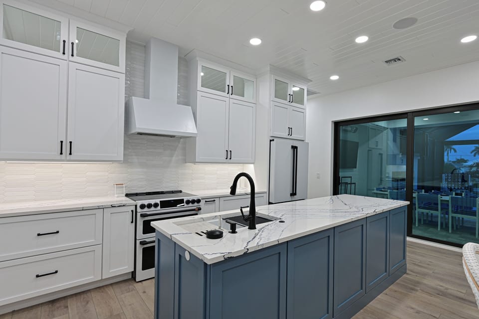 Large kitchen with double ovens.