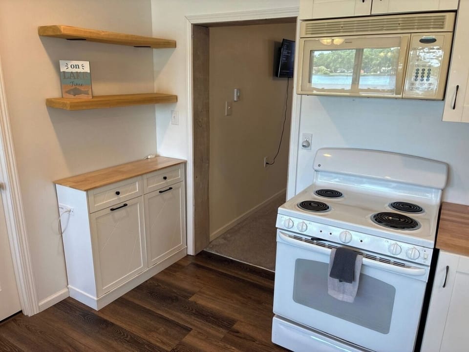 Enjoy the fully stocked kitchen with coffee maker, Keurig, and toaster.