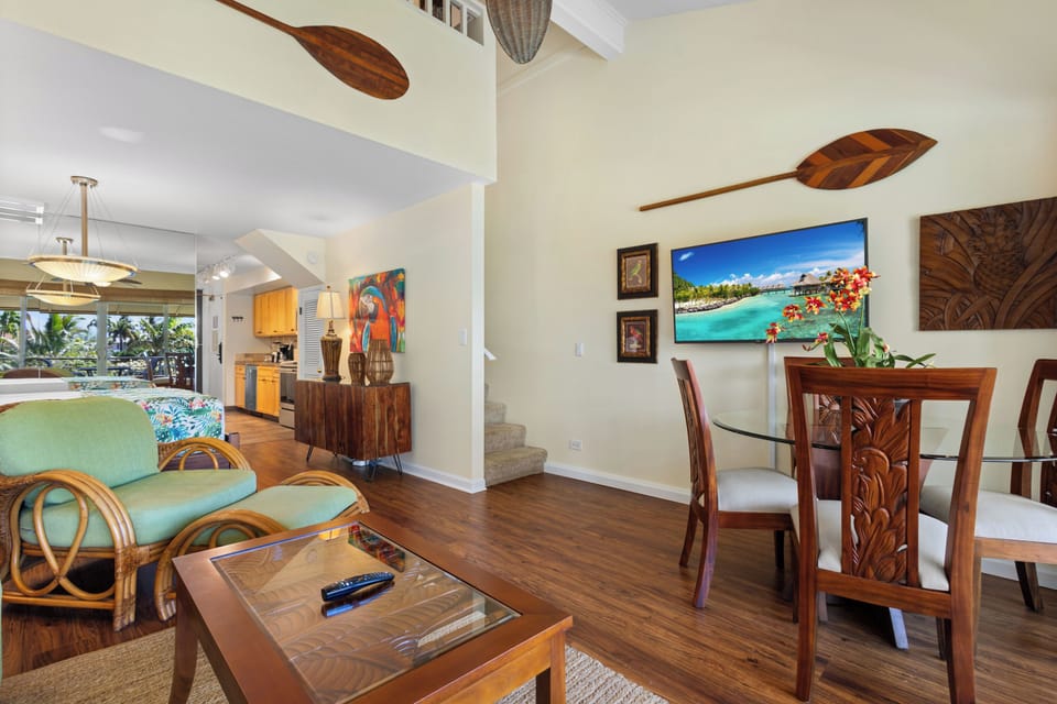 Relax in your tropical-inspired living space where island artistry meets comfort. Rich wood tones, handcrafted décor, and breezy seating create a welcoming retreat for unwinding after beach days.