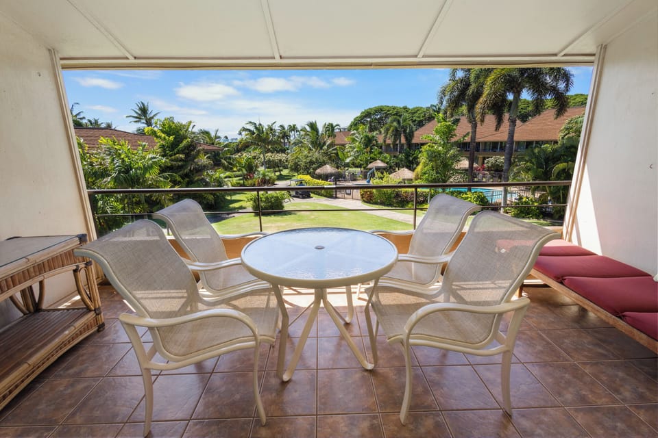 Sip your morning coffee on your private balcony overlooking lush tropical gardens and resort grounds, framed by swaying palms and endless blue skies.