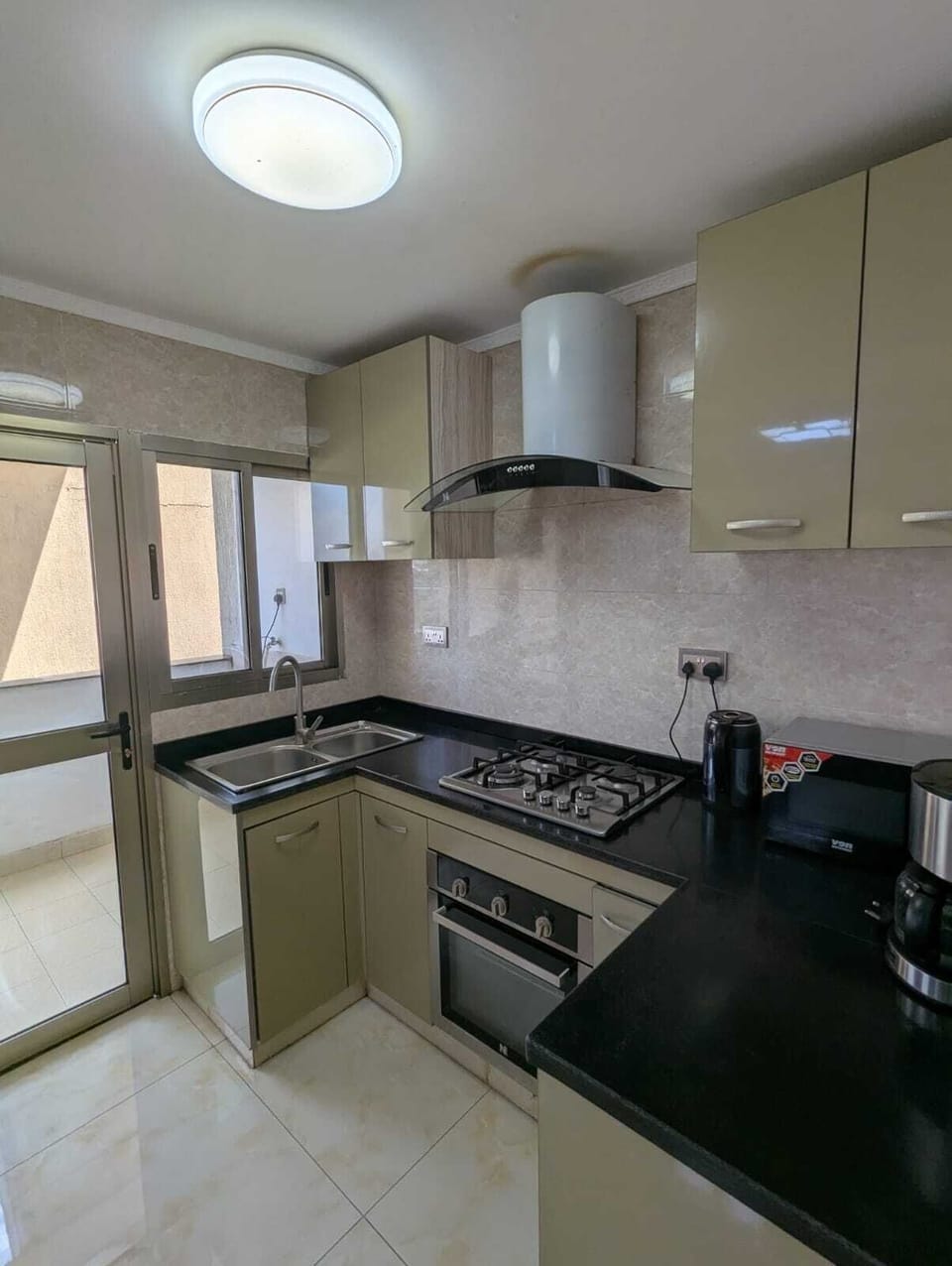 Full-size fridge, microwave, electric kettle, paper towels