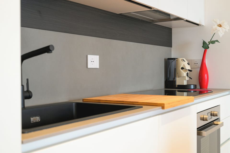 Deluxe Apartment, Sea View | Private kitchen | Full-size fridge, oven, stovetop, dishwasher