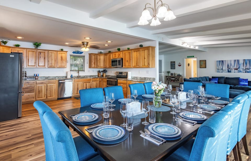 Group dining sits directly beside the kitchen, making serving meals simple and convenient.
