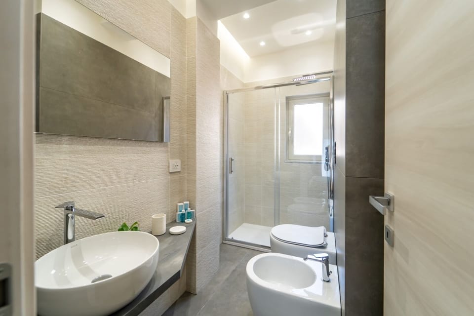 Deluxe Triple Room, Private Bathroom, Sea View | Bathroom | Shower, rainfall showerhead, free toiletries, hair dryer