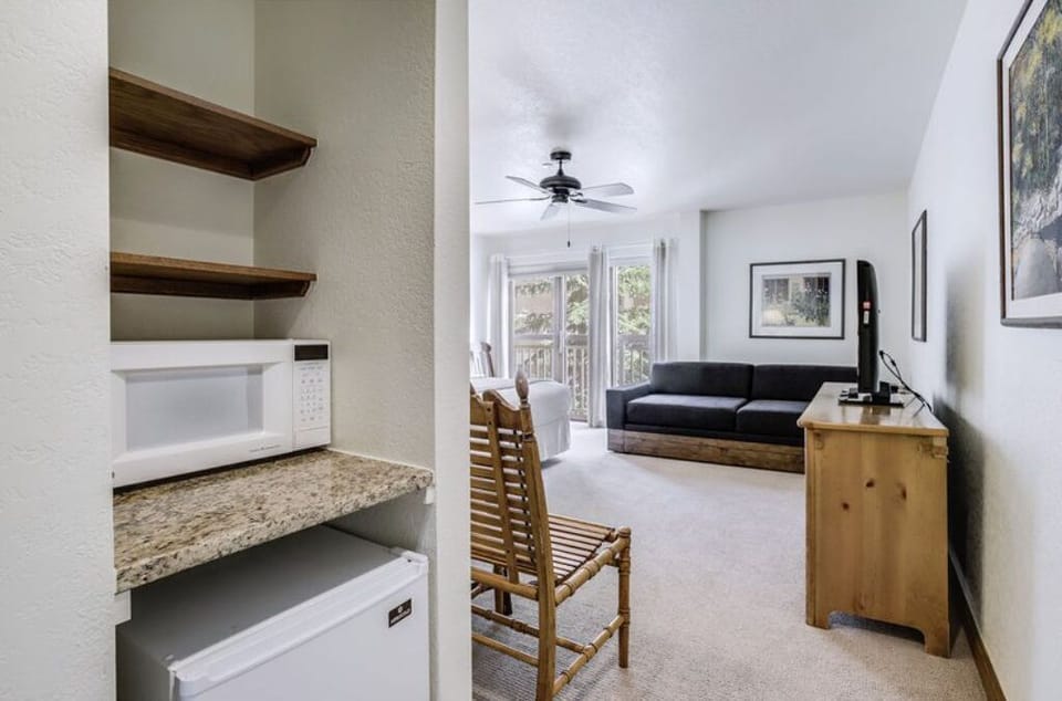 This versatile room includes bunk beds and a dedicated workspace, perfect for families or groups needing extra sleeping arrangements and a place to work.