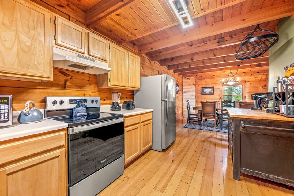 Cook, dine and enjoy in our quaint cabin kitchen.