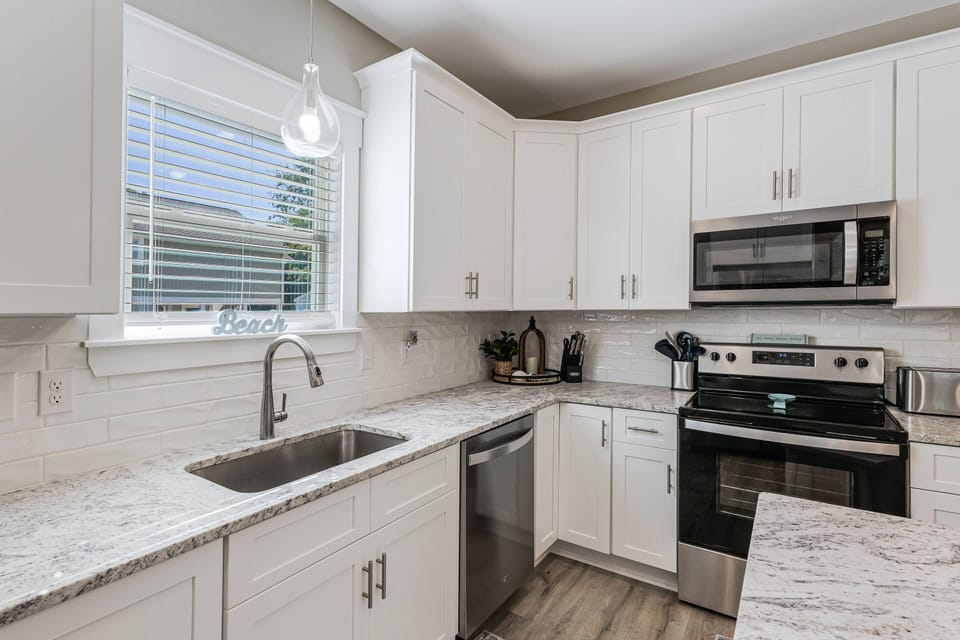 Well stocked Kitchen with spacious countertops for easy meal preparation.