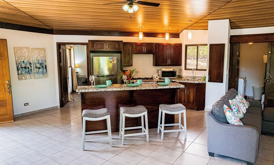 An open-concept living room seamlessly connected to the kitchen for a spacious feel.