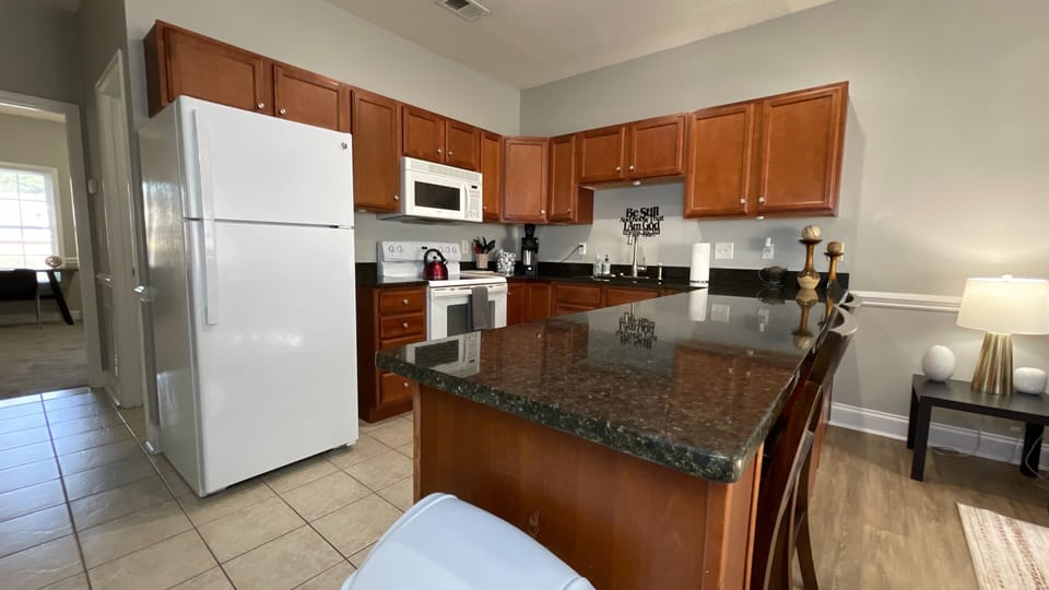 Cook up a storm in our clean and cozy kitchen, fully equipped with everything you need and a spacious long table for dining!