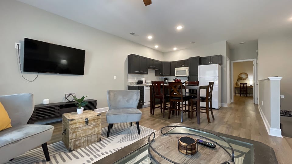 Discover the perfect blend of comfort and elegance in our cozy living room, featuring a stunning dining table!