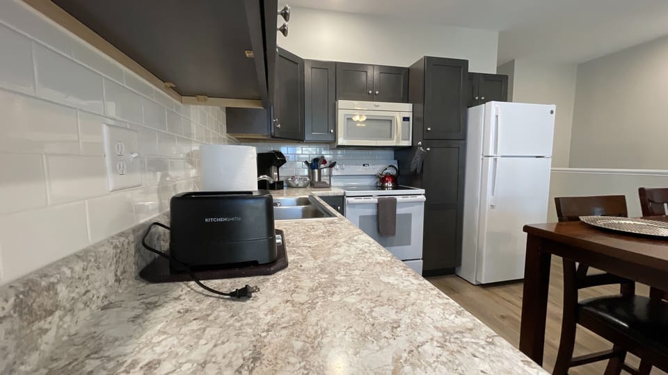 Experience the joy of cooking in our spotless, inviting kitchen—your culinary sanctuary!