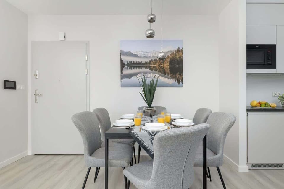 A sleek kitchenette connected to a cozy dining area. Perfect for shared meals and casual gatherings.