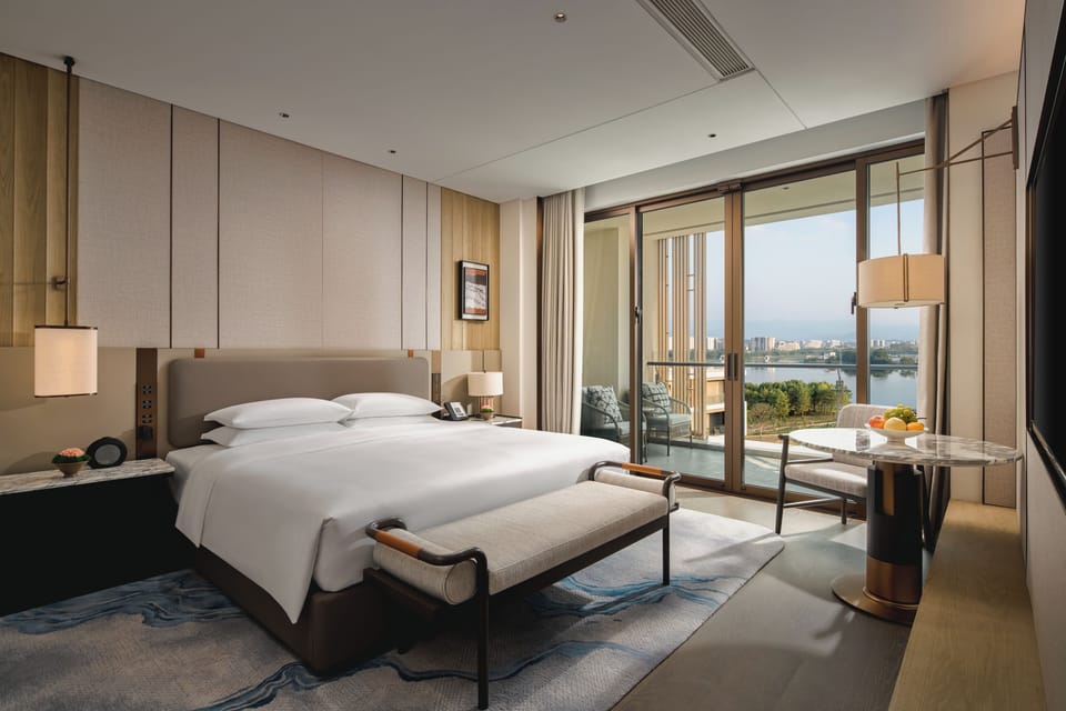 Deluxe Suite | Free minibar items, in-room safe, laptop workspace, blackout drapes