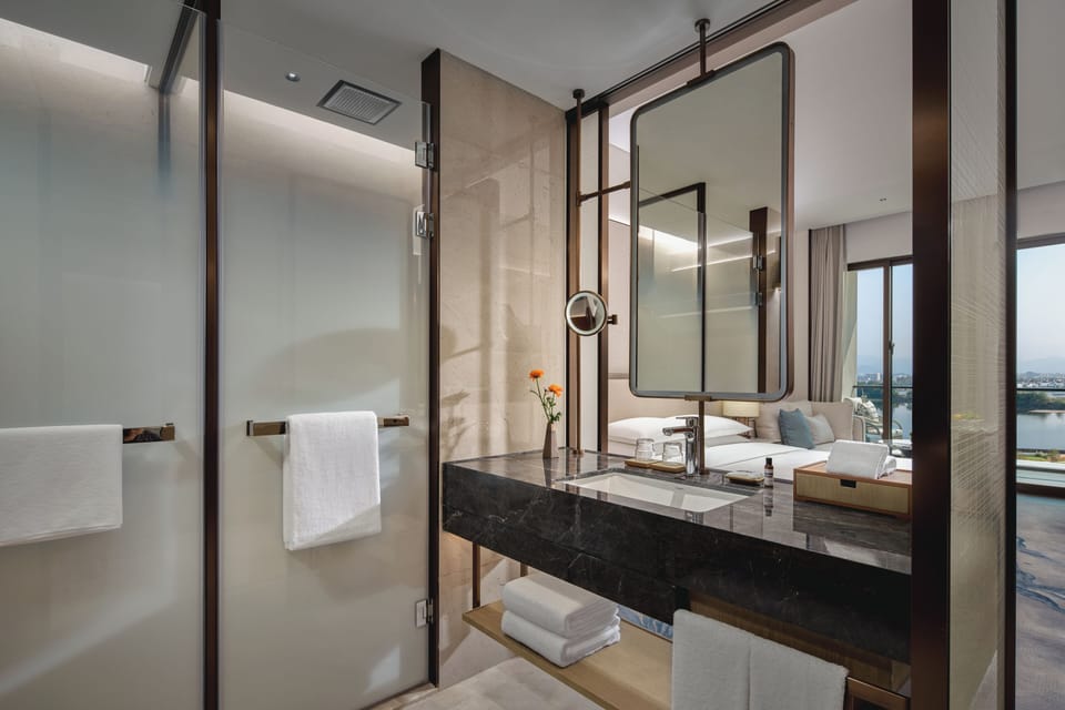 Designer toiletries, hair dryer, bathrobes, slippers