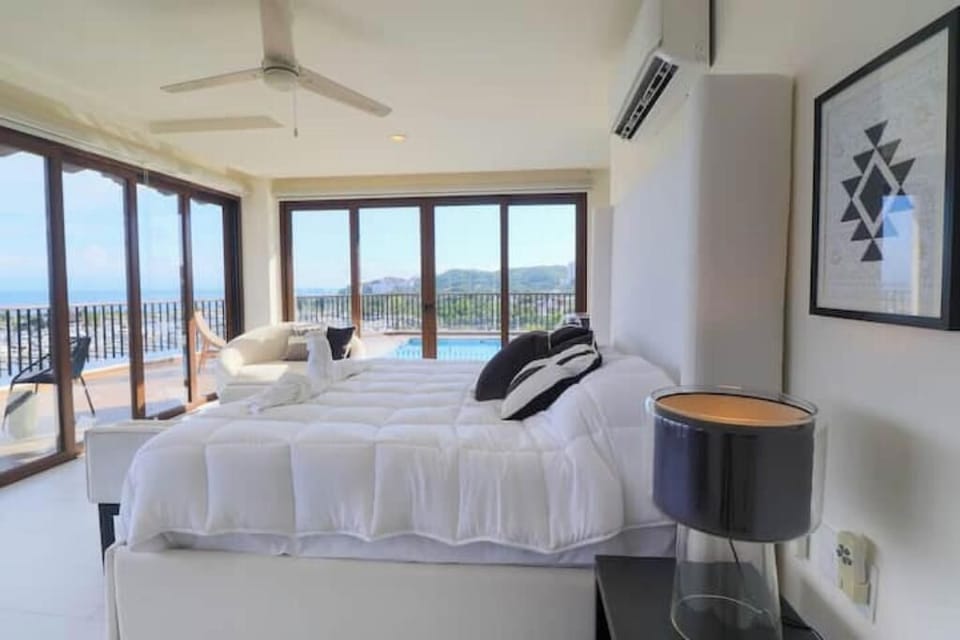 King size bed with unobstructed ocean views from a 6th level, Top Floor unit.