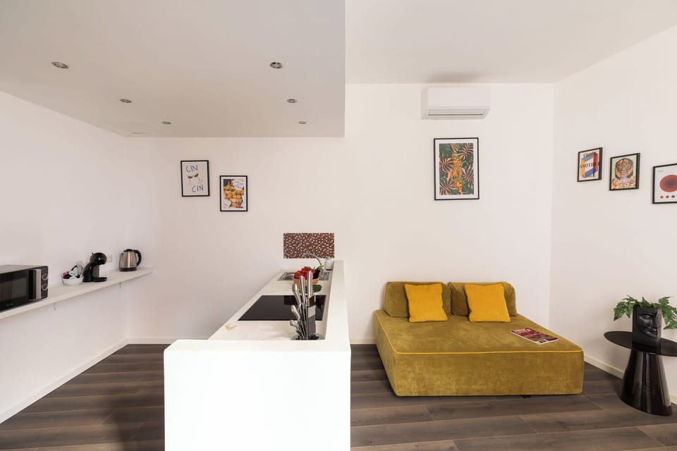 Deluxe Apartment, 2 Bedrooms | Living area | 32-inch LED TV with digital channels