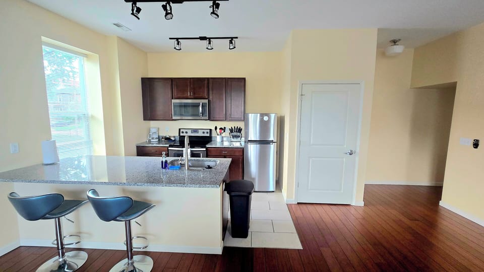 The kitchen features spacious countertops, offering ample room for meal prep.