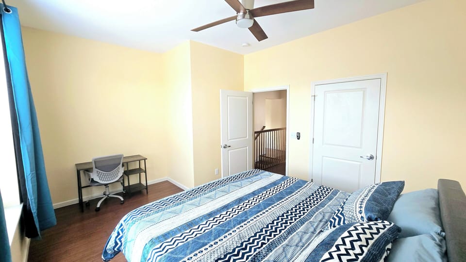 This king-sized bedroom offers the perfect retreat for relaxation and comfort.