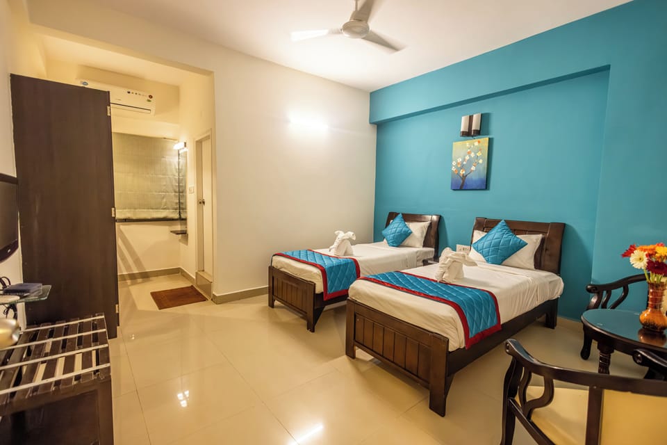 Desk, laptop workspace, bed sheets, wheelchair access