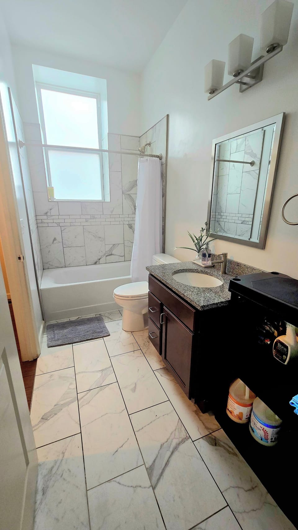 This serene bathroom features a relaxing bathtub.
