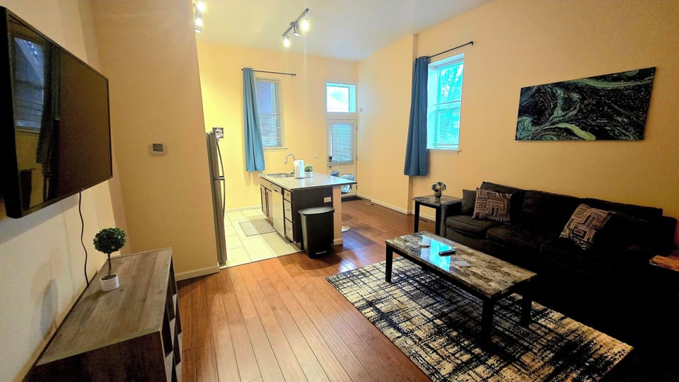 The cozy living room is designed for relaxation and entertainment.
