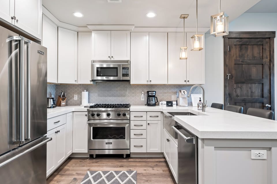 Modern kitchen with stainless steel appliances, generous counter space, and everything you need to cook at home. Great for quick breakfasts or group meals.