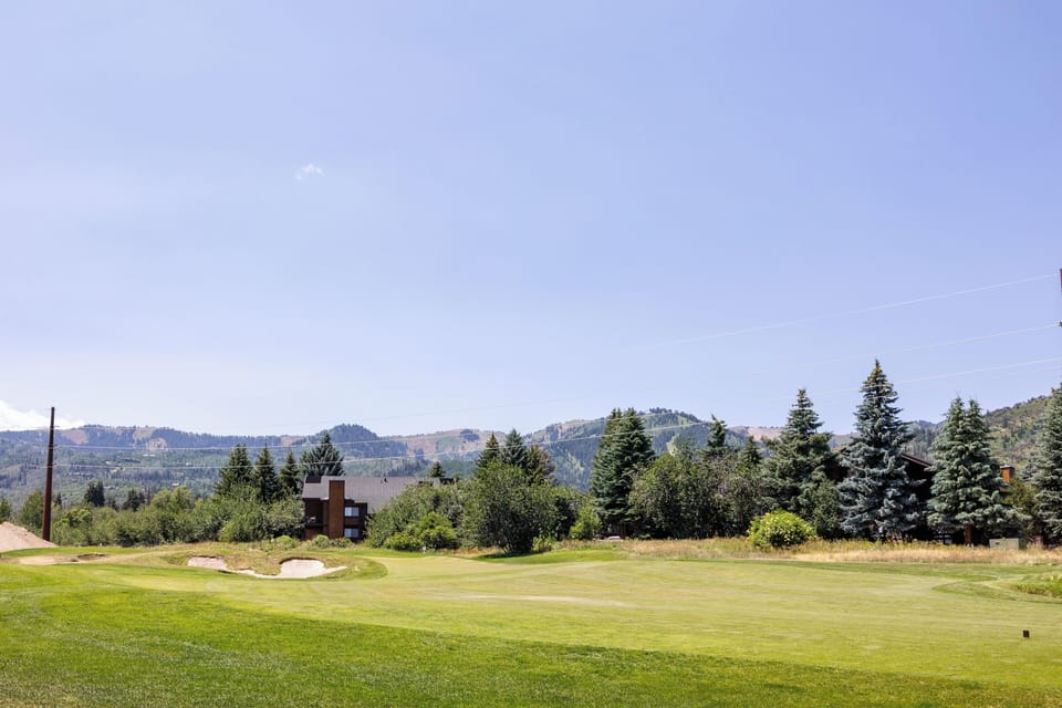- Golf course views with open greenery  
- Perfect spot for morning walks  
- Scenic mountain backdrop for photos