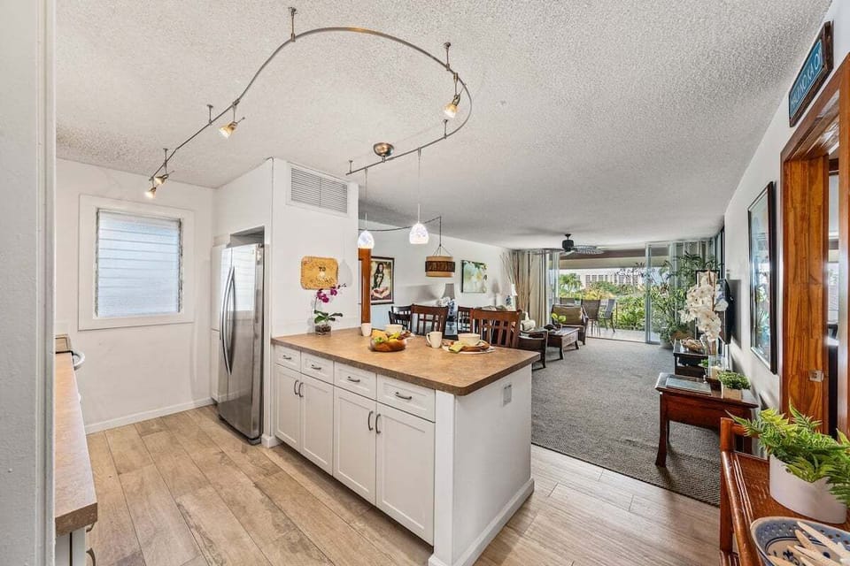 Open-concept layout flows seamlessly into the kitchen and dining area