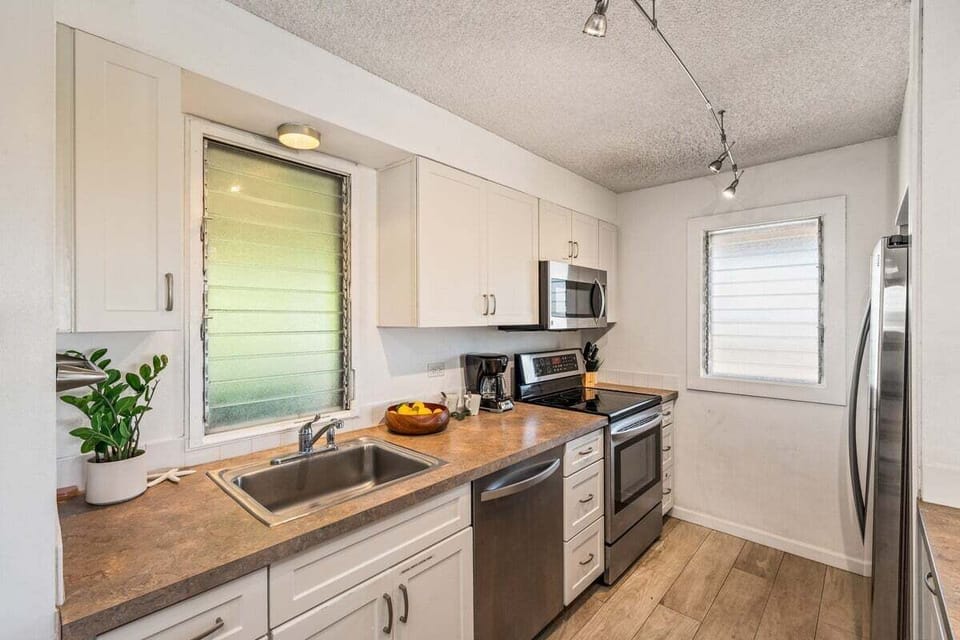 Enjoy cooking at your fully furnished kitchen with stainless steel appliances