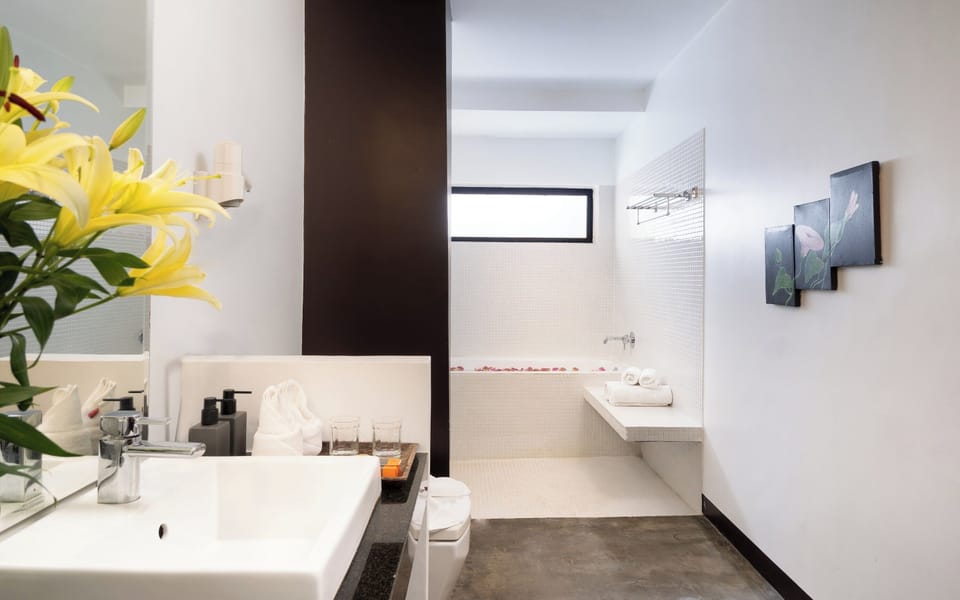 Junior King Suite Pool View with Balcony, Sofa, and Bathtub | Bathroom | Separate tub and shower, free toiletries, hair dryer, slippers