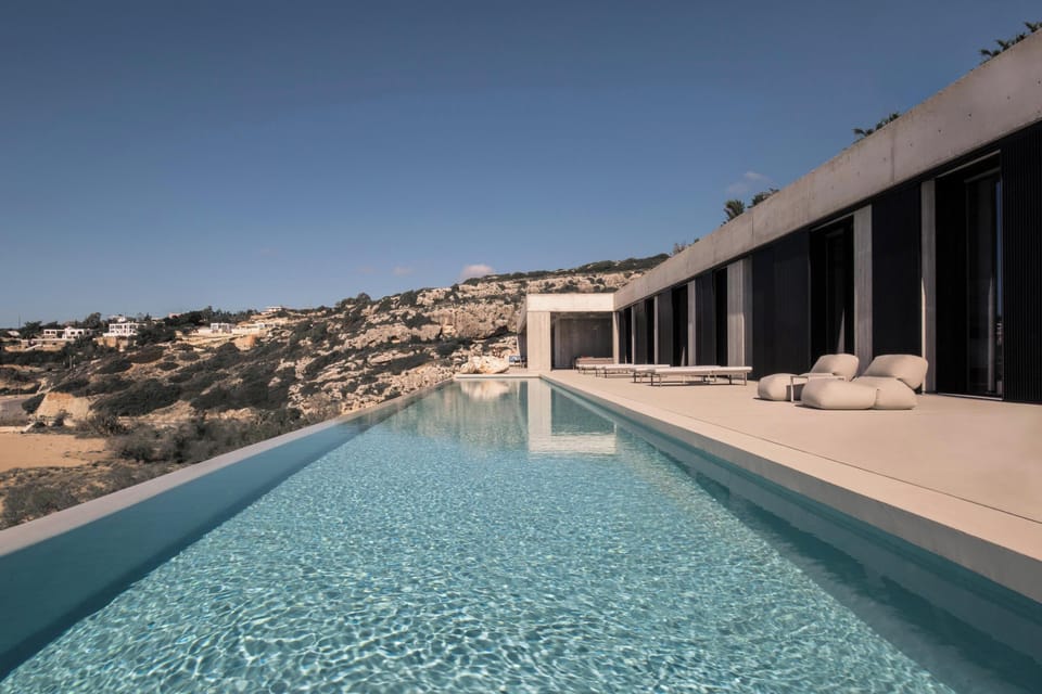 The villa boasts a breathtaking infinity pool and spacious outdoor areas, providing the perfect setting for an unforgettable holiday escape.