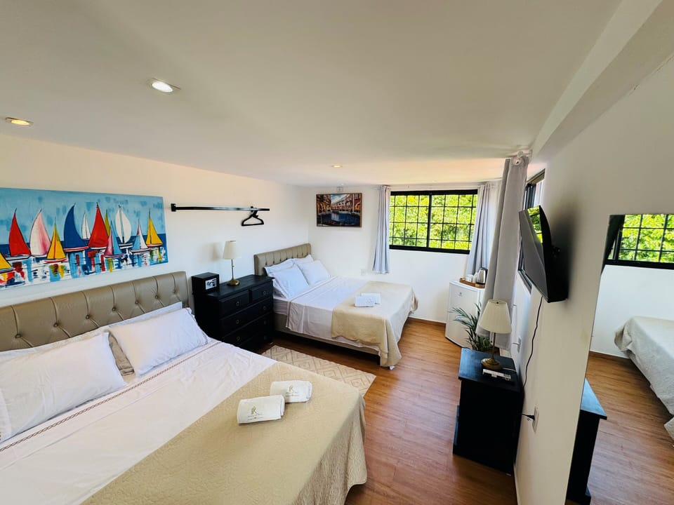 Panoramic Quadruple Room, Ocean View | Premium bedding, minibar, in-room safe, WiFi (free)
