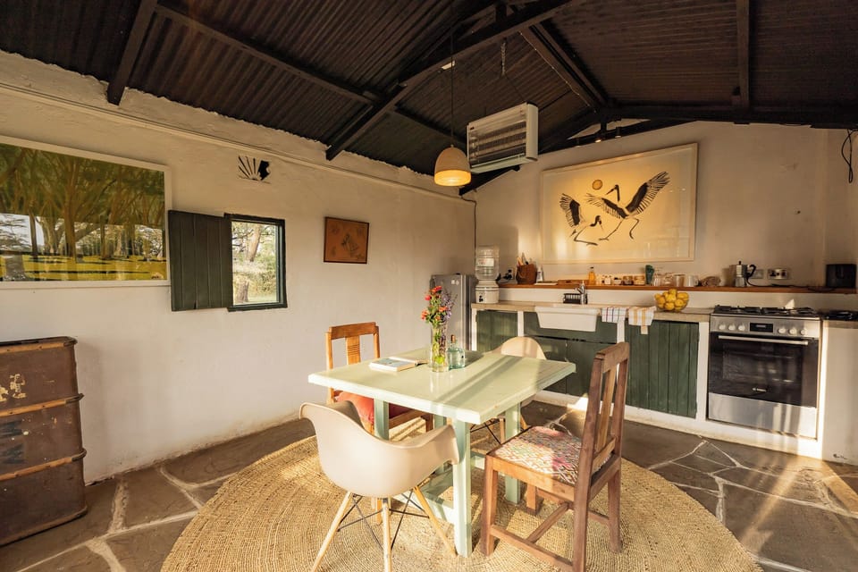 dining table with kitchen counter behind