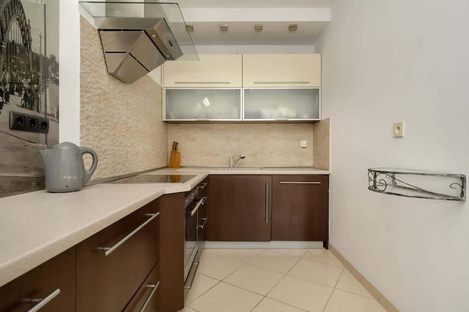 The sleek design of the kitchenette blending seamlessly with the living area.