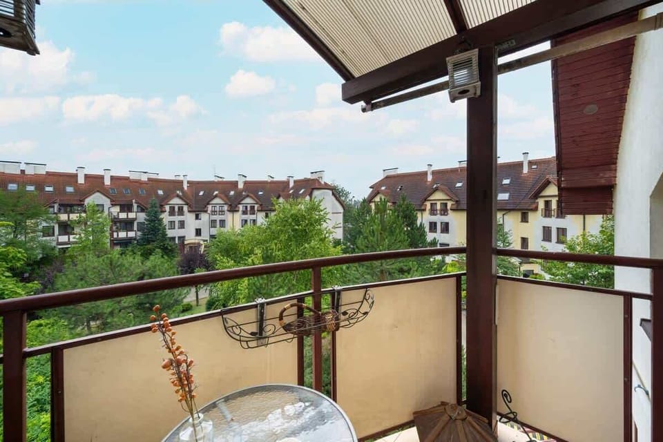 The balcony provides a perfect spot for enjoying the fresh air. 