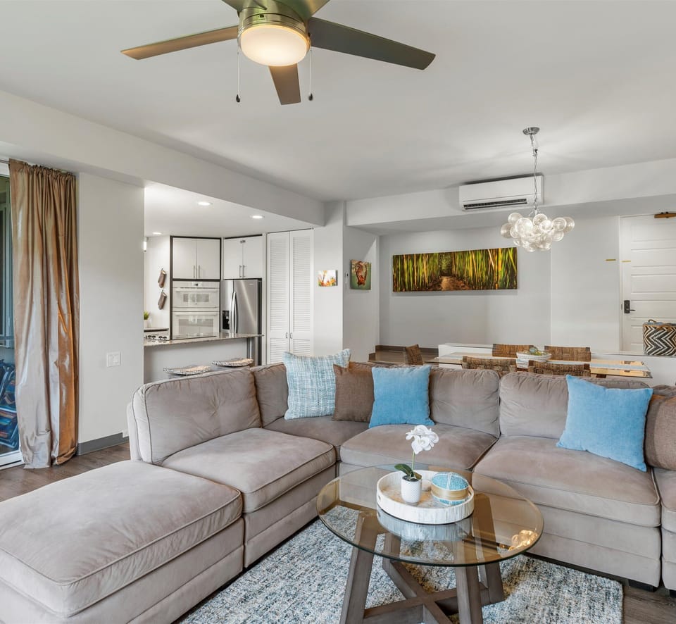 Relax in your spacious living area with plush sectional seating and modern comforts, while staying cool with ceiling fan and air conditioning.