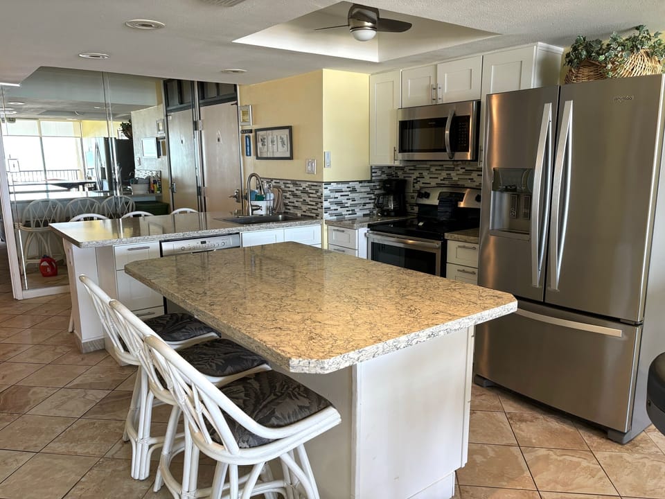 Kitchen Island Plus Bar Area offers Additional Seating for 6