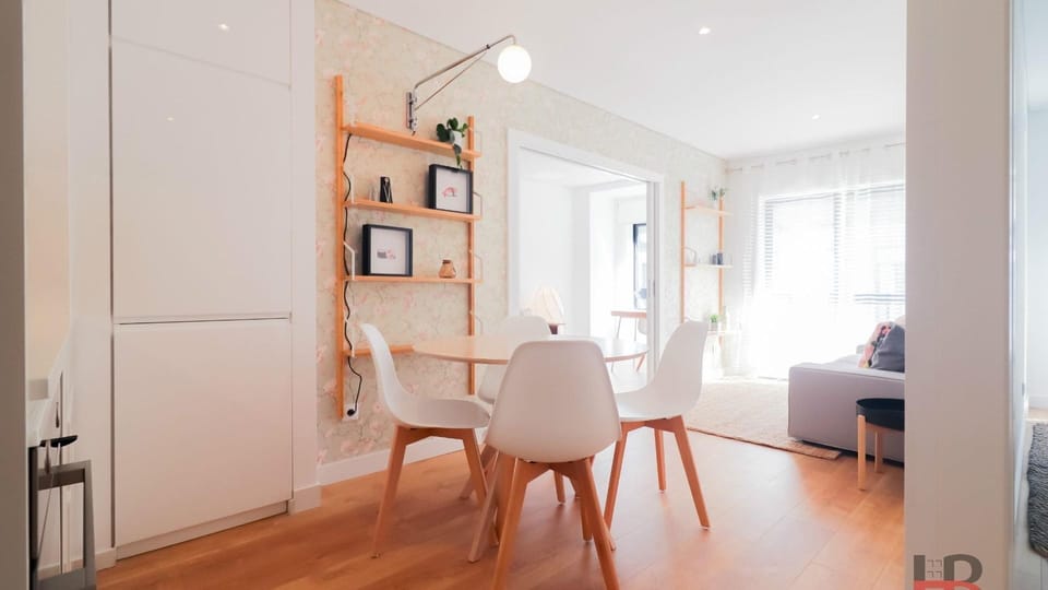 Enjoy delicious meals together at this chic dining table, seamlessly flowing into a bright living area where you can unwind after a day of exploring. The open plan design ensures a spacious and inviting atmosphere for relaxation and socializing.