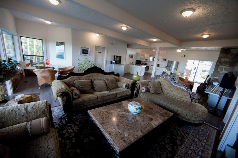 Spacious living room with plenty of room for everyone to relax together.