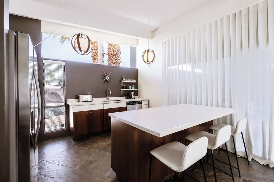 Kitchen has great clerestory windows bringing in lots of light.