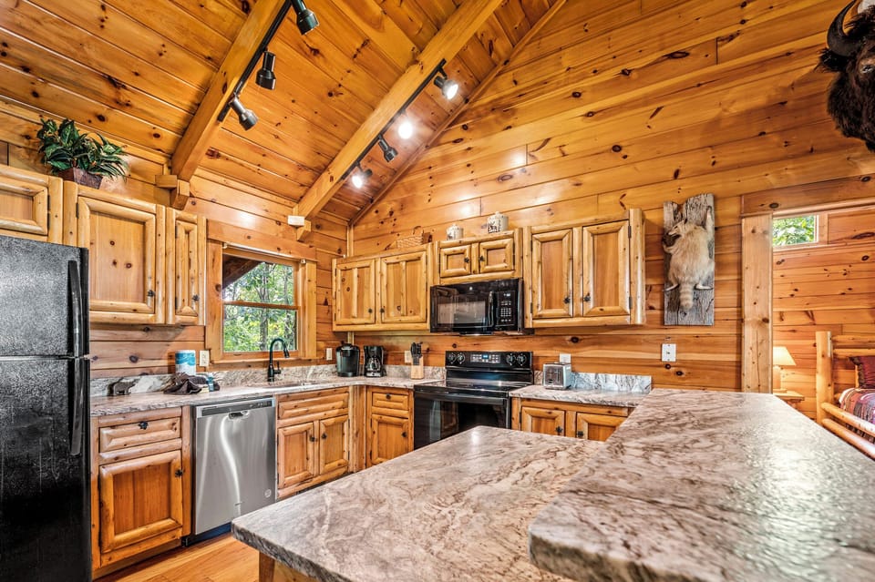 Leathered granite counters, kitchen stocked with tools to prepare a gourmet meal