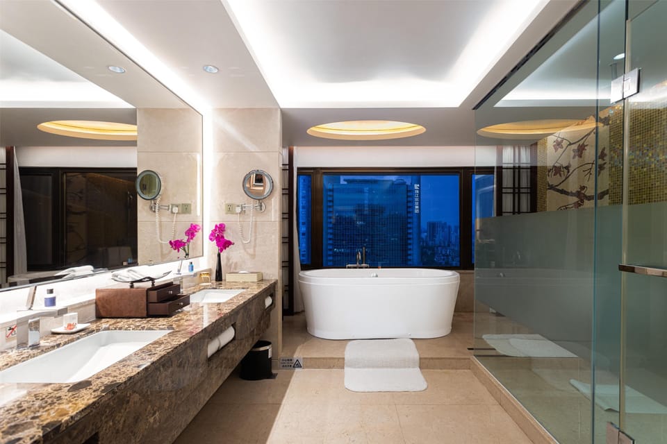 Separate tub and shower, rainfall showerhead, hair dryer, bathrobes