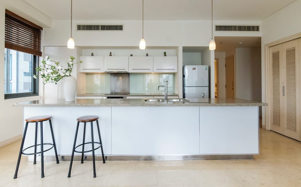 Family Suite, 2 Bedrooms, Balcony, City View | Private kitchen | Fridge, microwave, oven, stovetop
