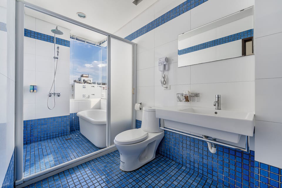 Quadruple Room, Balcony | Bathroom | Hair dryer, slippers, towels, shampoo