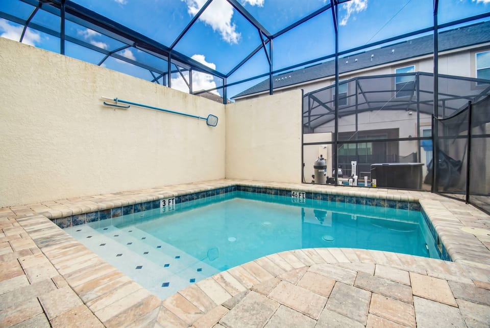 Bask in the luxury of your private pool, framed by sleek stone tiles and surrounded by a protective screen, ensuring your relaxation is uninterrupted. Sunlight streams in, creating a perfect setting for leisurely afternoons.