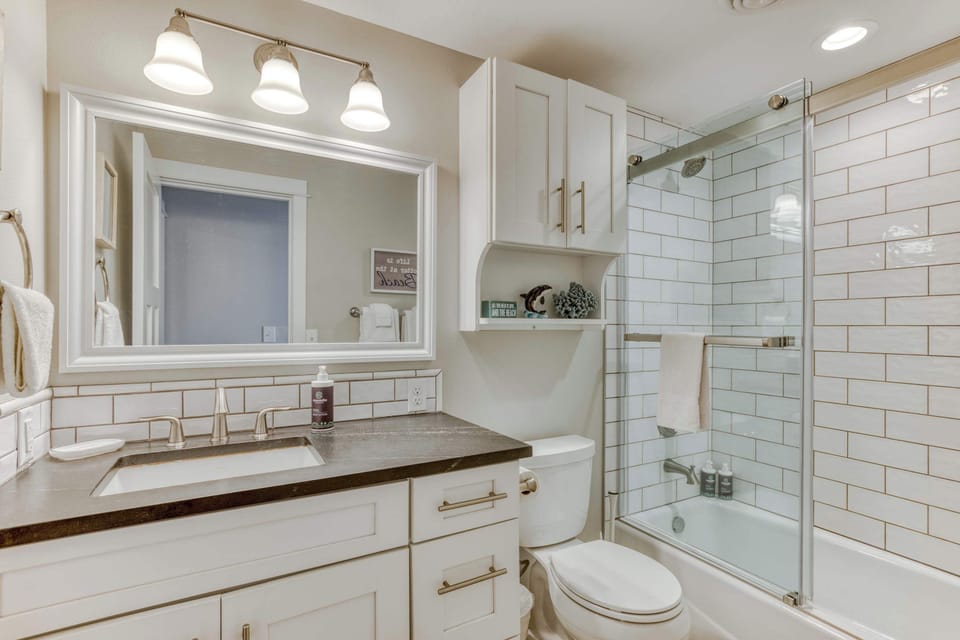 Start your day right in our clean & bright bathroom. Tub for soaking & all the essentials provided.