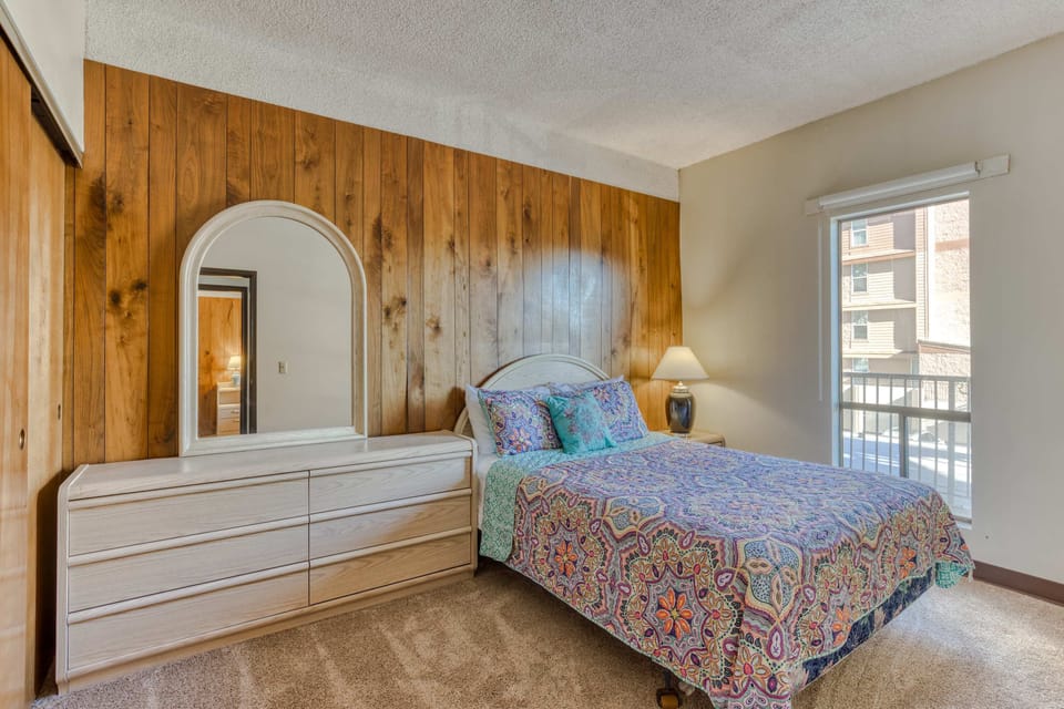 Settle into this comfortable bedroom with soft bedding and ample storage.