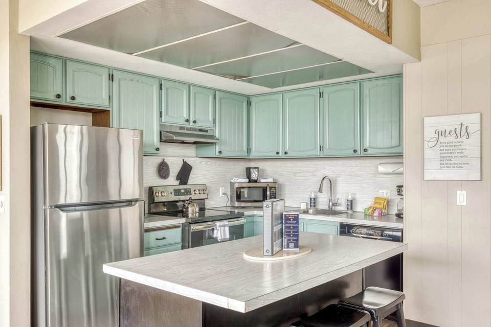 Functional kitchen providing essential appliances creating a clean and practical cooking space