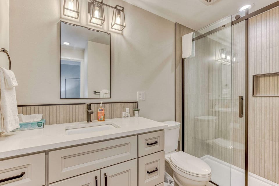 Dedicated primary bathroom with spacious walk in shower to relax and wash the day away.