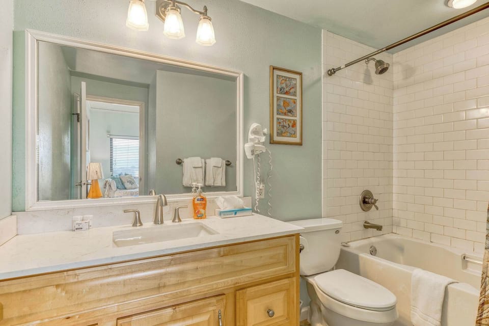 Dedicated primary bathroom featuring a relaxing tub—perfect for end-of-day pampering.